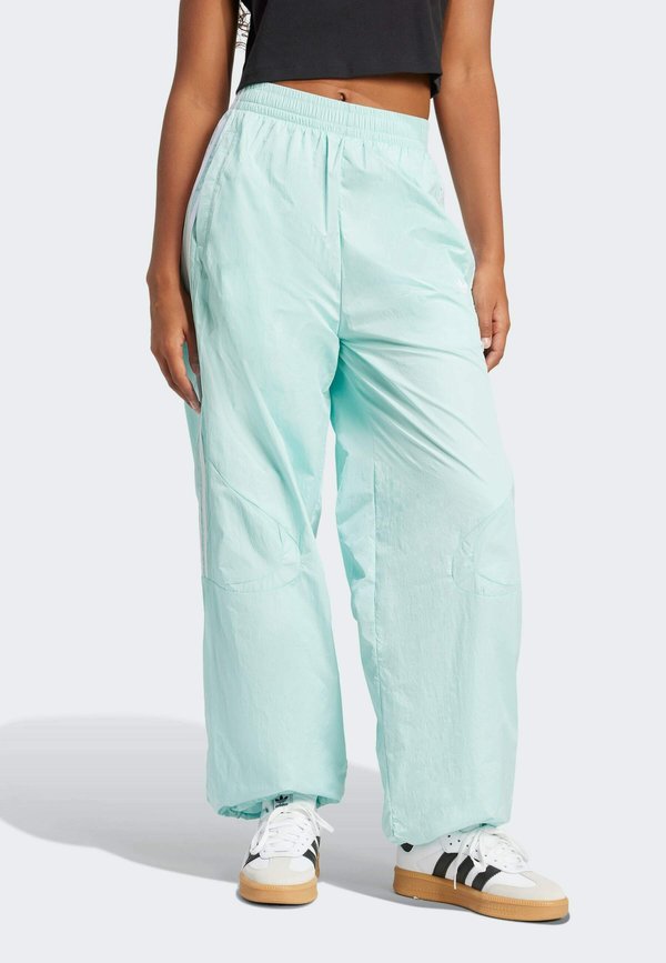 ADICOLOR TEAMGEIST OVERSIZED WIDE - Tracksuit bottoms - semi flash aqua