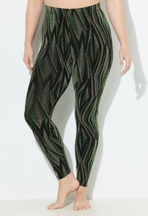 Leggings verts et noirs avec un motif en zigzag et des accents métalliques. Fabriquées en matériau extensible, elles disposent d'une taille élastique.