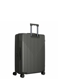 Valise rigide de couleur gris foncé avec des nervures verticales, poignée rétractable, quatre roues et une fermeture éclair latérale pour une fermeture sécurisée.