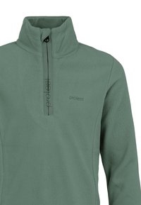 Pull en polaire vert atténué avec un col montant, demi-zip et logo brodé. Texture douce avec une finition lisse.