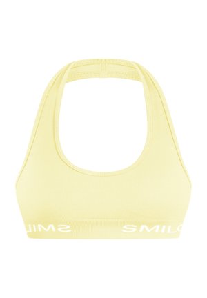 Gelber, gerippter Sport-BH mit Rundhalsausschnitt und breiten Trägern. Verfügt über weißen Logotext entlang des unteren Bands. Glatte Textur.