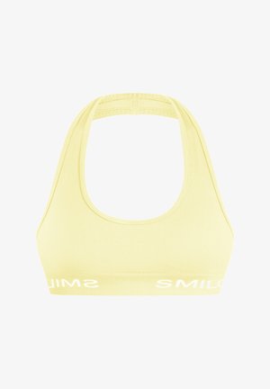 Gelber, gerippter Sport-BH mit Rundhalsausschnitt und breiten Trägern. Verfügt über weißen Logotext entlang des unteren Bands. Glatte Textur.