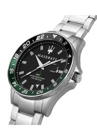 Orologio in acciaio inossidabile con quadrante nero, lunetta verde, indici bianchi e finestra della data. Impermeabile fino a 100 metri.