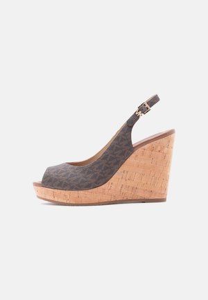 Women's cork wedge sandal with gray fabric upper, open toe, and adjustable ankle strap featuring a small gold buckle.