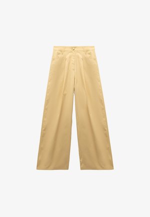 Wijde broek in lichtgele stof, met een hoge taille, een knoopsluiting aan de voorkant, twee zijzakken en een gladde textuur.