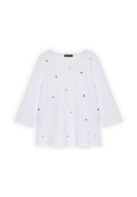 Camicia bianca a maniche lunghe con scollatura rotonda, caratterizzata da decorazioni sparse in oro, rosso e nero e una vestibilità ampia. Materiale in cotone morbido.