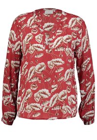 Rode blouse met een bloemenprint in crème en bruin, met lange mouwen en een V-hals. Lichtgewicht stof met een relaxte pasvorm.