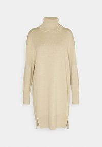 Robe-pull longue beige avec col roulé haut, manches longues, poignets côtelés et fentes latérales à l'ourlet.