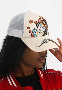 Trucker cap featuring a cream front with embroidered floral and Geisha design, white mesh back, and "Ed Hardy" logo on the brim.
