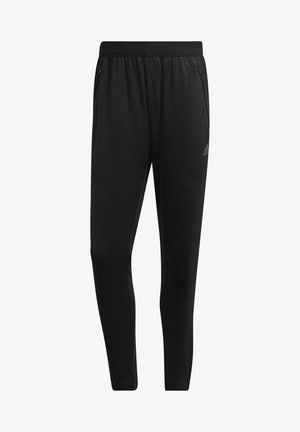Zwarte sportieve slanke broek met een elastische tailleband en met rits afsluitbare zijzakken, met een klein Adidas-logo op de linker dij.