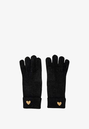 Guanti neri lavorati a maglia con cinque dita, dotati di un polsino a coste e un piccolo accento a forma di cuore dorato sul polso. Texture morbida su tutta la superficie.