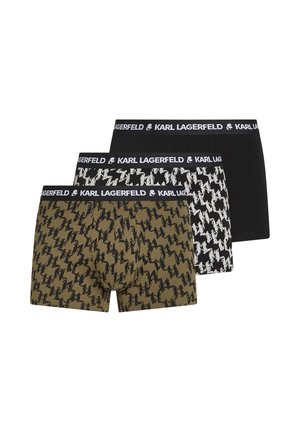 Drei Paar Herren-Boxershorts: ein olivgrünes mit schwarzem Blitzmuster, ein schwarzes mit weißem Hahnentritt und ein einfarbig schwarzes.