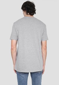 Gray short-sleeve t-shirt in soft cotton material with a straight cut, featuring a classic crew neckline and a simple, smooth texture.