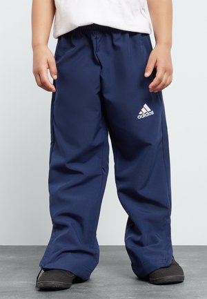 Marineblaue Polyester-Jogginghosen mit elastischem Bund und einem weißen Adidas-Logo auf dem linken Bein. Lockere Passform mit geraden Beinen.