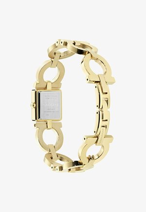 Kulla toonis Ferragamo lingitud käekell ruudukujulise sihverplaadiga, roostevabast terasest tagaküljega ning graveeritud brändinimega luku ja korpuse tagaküljel.