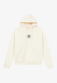 Cream-colored hoodie made of soft fabric, featuring a front pocket, drawstring hood, and a round embroidered logo on the chest.