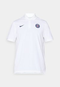 Hvid polo-shirt lavet af bomuld, med krave, korte ærmer, navy Nike-logo og et cirkulært Paris-emblem på venstre bryst.
