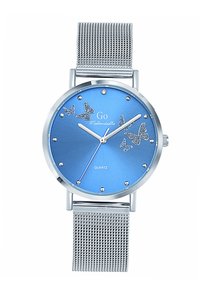 Montre à quartz avec un cadran métallisé bleu, bracelet en maille argentée, ornée de motifs de papillon et d'accents en cristal autour du cadran.