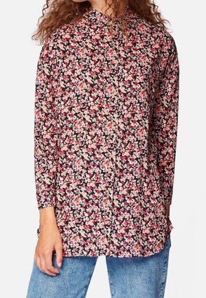 Florales Hemd in Schwarz mit rosa und cremefarbenen Blumen, langen Ärmeln und hohem Kragen. Weicher Stoff mit lockerer Passform.
