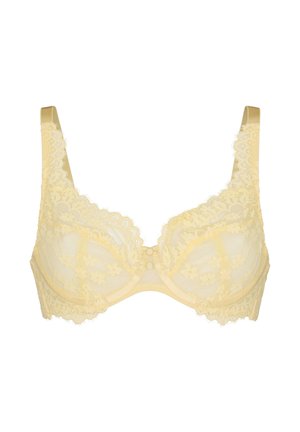 Reggiseno giallo in pizzo con ferretto, motivi floreali e spalline regolabili su sfondo bianco.