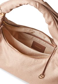 Pink textured handbag with a smooth interior, gold hardware, and a visible brand tag. Includes zipped compartments for organization.