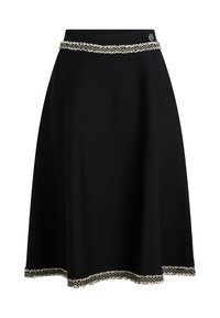 Black skirt with a flared design, featuring a textured waistband and a decorative white fringe trim along the hem.