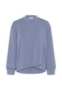 Felpa azzurra chiara con colletto alto, spalle scese e orlo corto. Realizzata in morbido tessuto testurizzato con un design semplice.