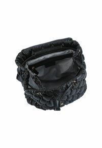 Black quilted leather bag with a cinched top. Interior features striped fabric lining and zippered pocket for storage.