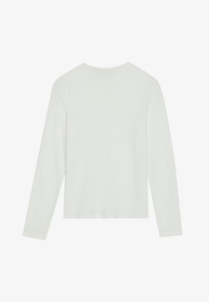 Bela dolga majica s kratkimi rokavi z strukturiranim pletenim vzorcem. Ima okroglo ovratnico in ravno spodnji rob. Mehka, lahka tkanina.