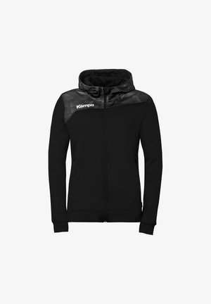 Veste à capuche noire zippée intégralement avec empiècement à motifs, manches longues, poches frontales et logo blanc "Kempa" sur la poitrine gauche.
