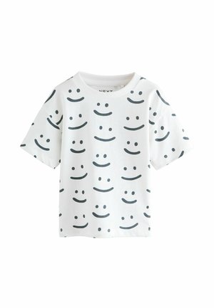 T-shirt bianco a maniche corte realizzato in cotone, con motivi di facce sorridenti nere in diverse posizioni, scollatura rotonda e vestibilità comoda.