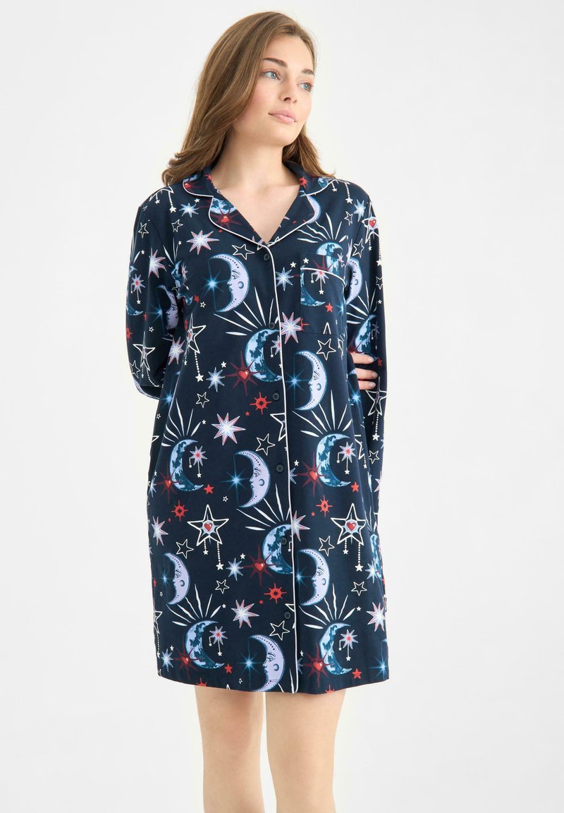 Navy nightgown with a moon and star pattern, featuring white piping, a collar, and full-length sleeves. Made from soft fabric.
