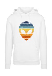 White hoodie featuring a colorful alien graphic with horizontal stripes in blue, teal, orange, and yellow. Centered design with a vintage texture.