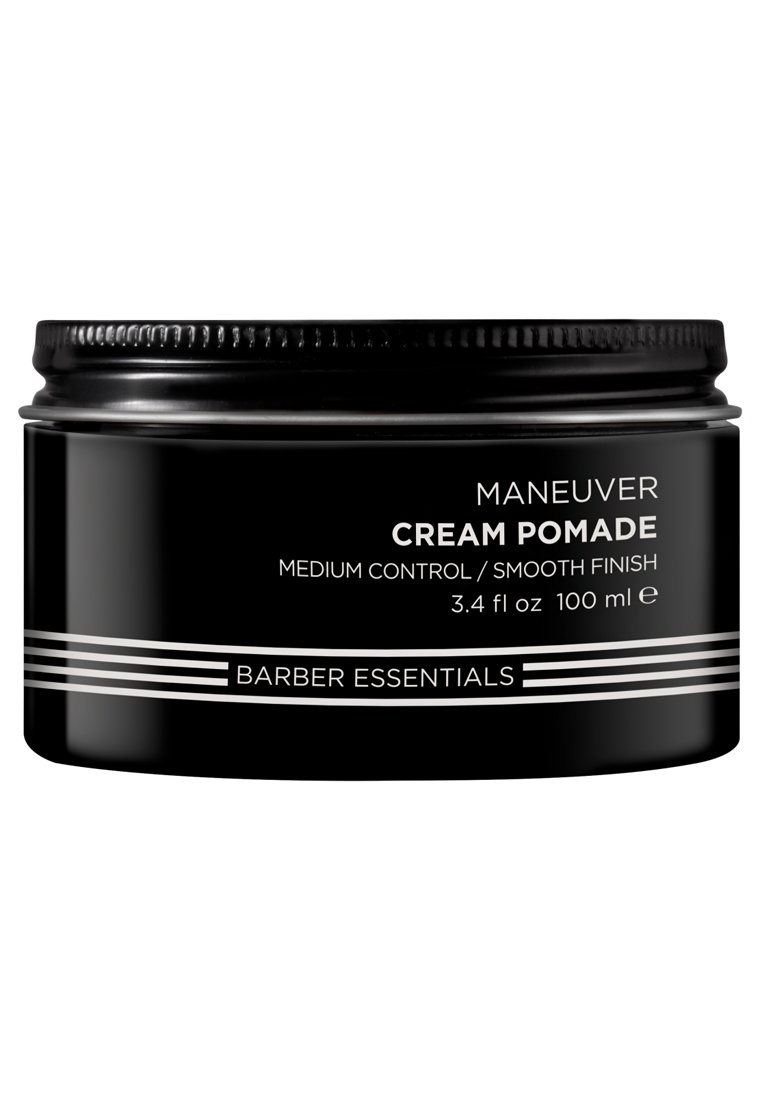 Pot noir rond avec une surface lisse. Étiqueté "Crème Pomade Maneuver", features des bandes et du texte argentés. Contient 3,4 fl oz (100 ml).