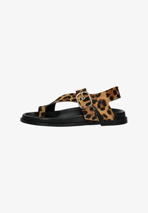 Leopard print flat sandals with black rubber sole, adjustable strap featuring a gold buckle, open design, and textured fabric.