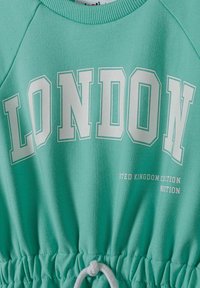 Tyrkysová mikina s bílým nápisem 'LONDON'. Má šňůrku v pase a žebrovaný výstřih. Vyrobena z měkké bavlny, má pohodlný design.