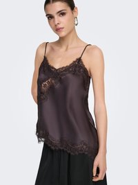 Camisole en satin brun foncé avec délicate bordure en dentelle, bretelles spaghetti réglables et silhouette fluide. Détail ourlet festonné.
