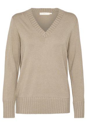 Beige kötött pulóver V-nyakkal, bordázott díszítéssel és hosszú ujjal. Sima textúra, testhez simuló dizájn, finom részletezéssel a gallérnál.