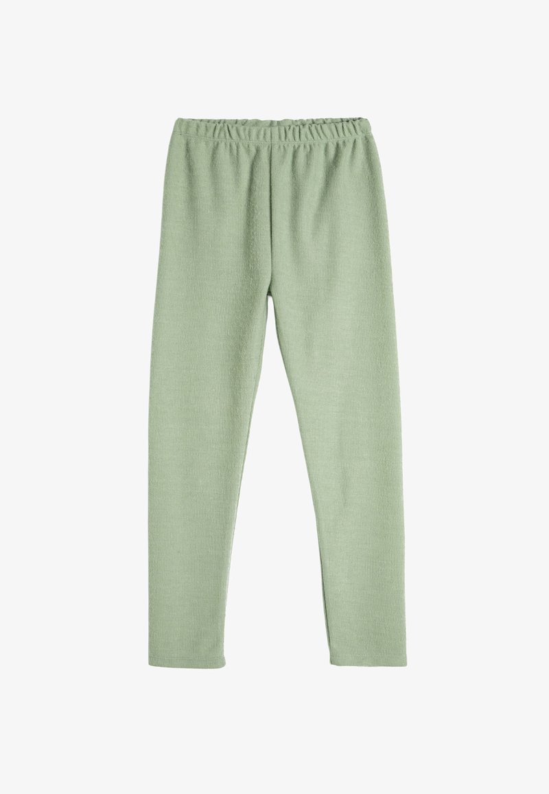 Leggings verde claro hechos de una tela texturizada. Con una cinturilla elástica y un diseño ajustado. Elásticos y cómodos.
