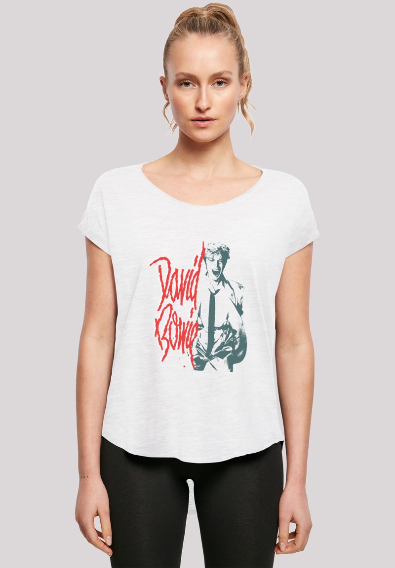 White short-sleeve t-shirt featuring a graphic print of a figure and "David Bowie" in red, with a relaxed fit and soft texture.