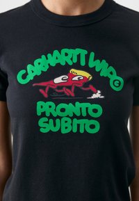 Black cotton t-shirt featuring a graphic print with green text "CARHARTT WIP" and "PRONTO SUBITO," plus a red character design.