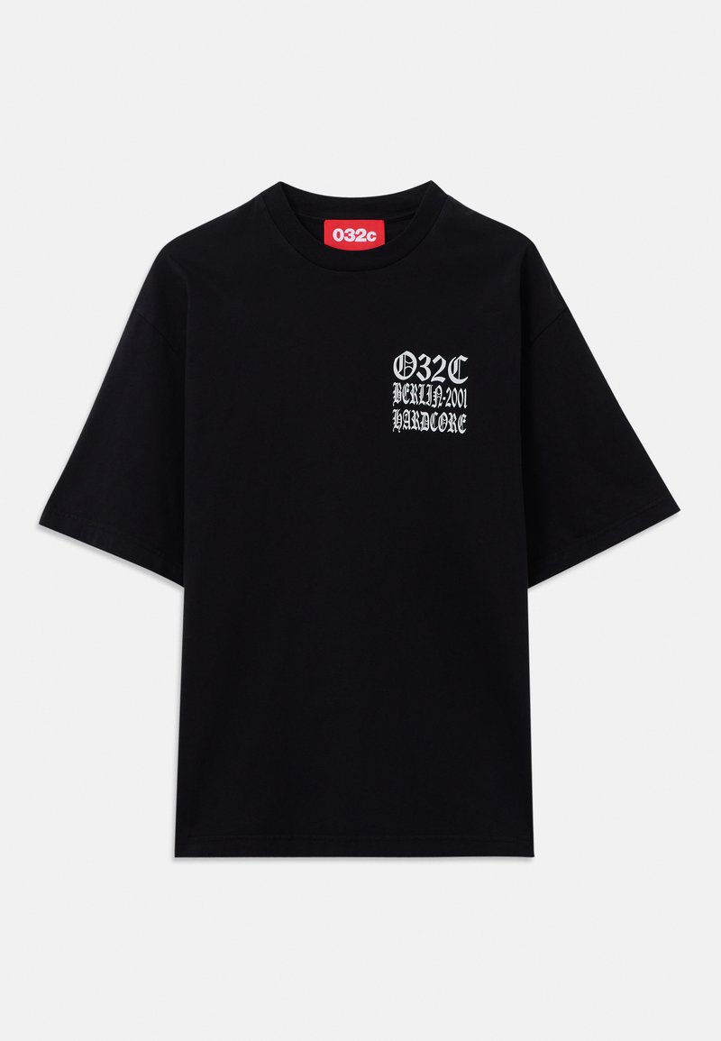 Black oversized t-shirt made of cotton. Features a white graphic print on the left side with the text "032C BERLIN 2001 HARDCORE."