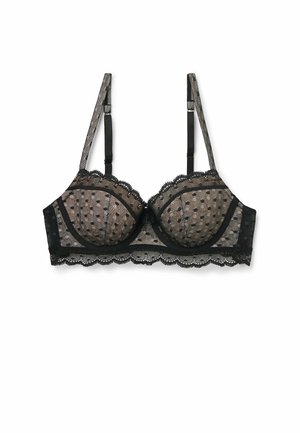 Black bra with polka dot pattern, lace trim, underwire cups, adjustable straps, and a scalloped edge. Sheer fabric with textured details.
