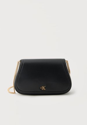 Black leather shoulder bag with gold chain strap and small gold "CK" logo on front center.