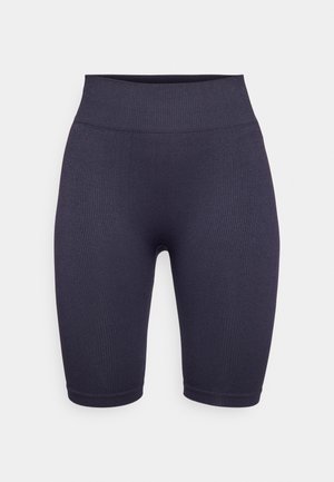Dark navy ribbed bike shorts with a high waistband, featuring a smooth texture and a knee-length cut. No visible hardware or patterns.