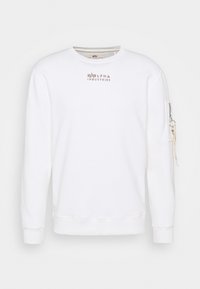 Felpa bianca con scollo rotondo, maniche lunghe e tasca con cerniera sulla manica sinistra. Logo ricamato sul petto.