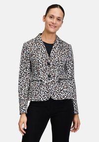 Luipaardprint blazer met zwarte accenten, enkelvoudig ontwerp, met notch revers, twee voorkezen en textiel met structuur.