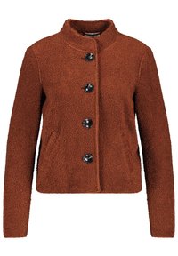 Brun, fluffig fleecejacka med ståkrage, framknäppning och långa ärmar. Har fyra svarta knappar för stängning.