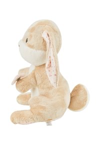 Plush rabbit toy with a beige and cream color scheme, textured fur, long floppy ears with a spotted pattern, and a small pink flower accessory.