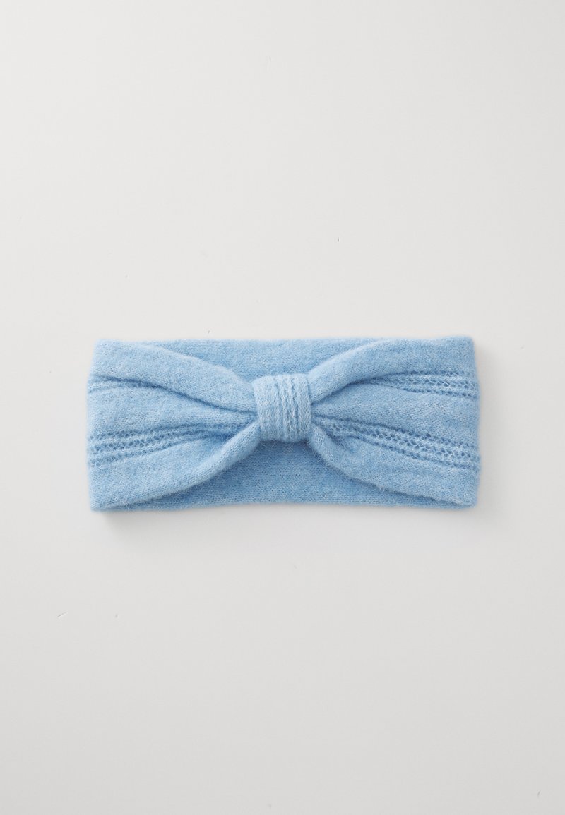 Light blue knitted fabric headband with a central twisted knot detail on a white background.
